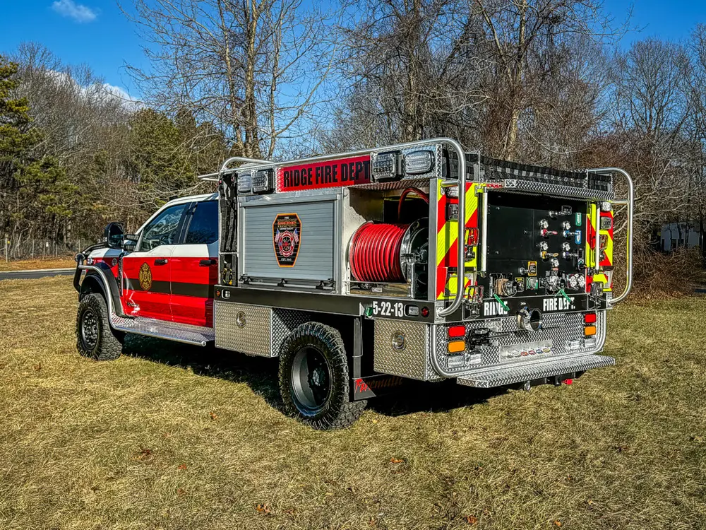Rear-right three-quarter view of the utility body and rear controls.
