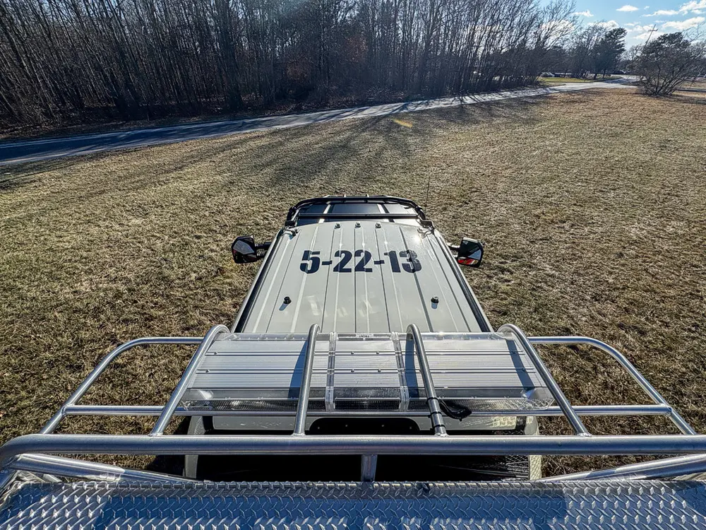 Forward roofline view over the upper deck and side rails.
