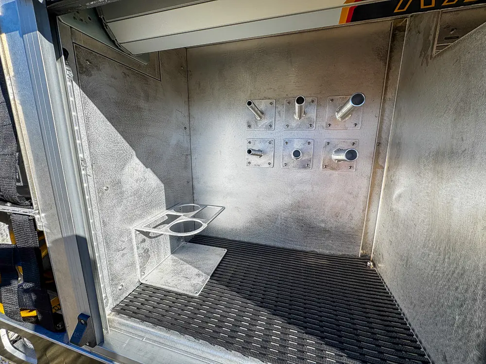 Open empty side compartment with shelving and wall mount points.