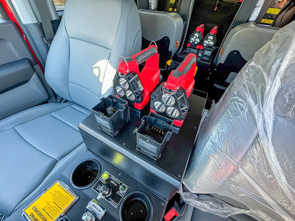 Center console and front seats close-up with mounted control levers.