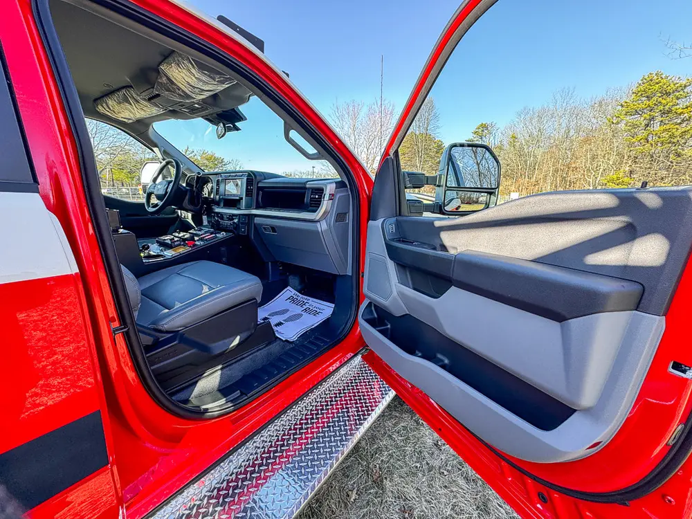Passenger-side front door open showing seat and interior door panel.
