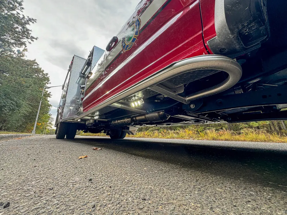 Low underside view along right side rocker and body edge.