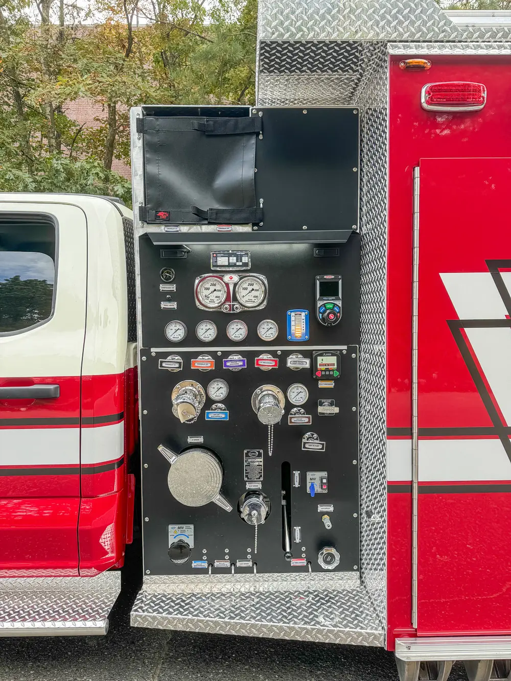 Rear-side pump panel with gauges and control valves.