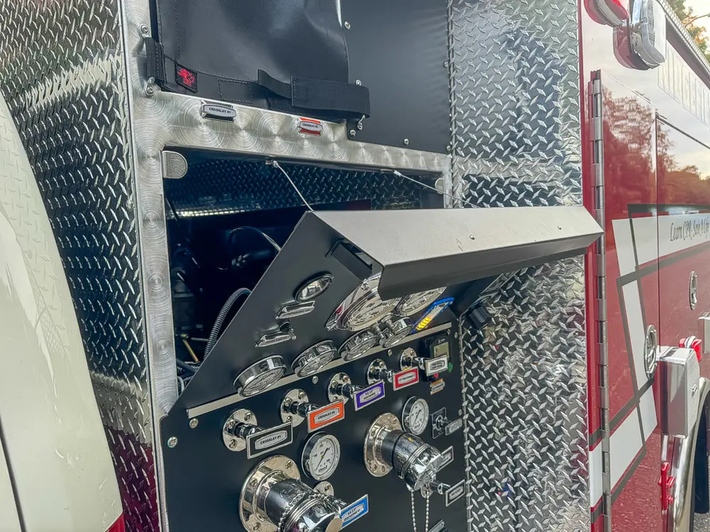 Fold-down side step/door close-up on rear side compartment.