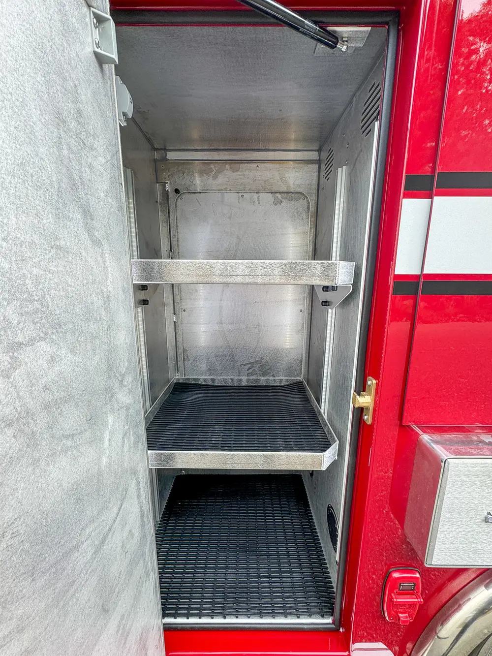 Compartment interior close-up showing upper shelf and clean walls.