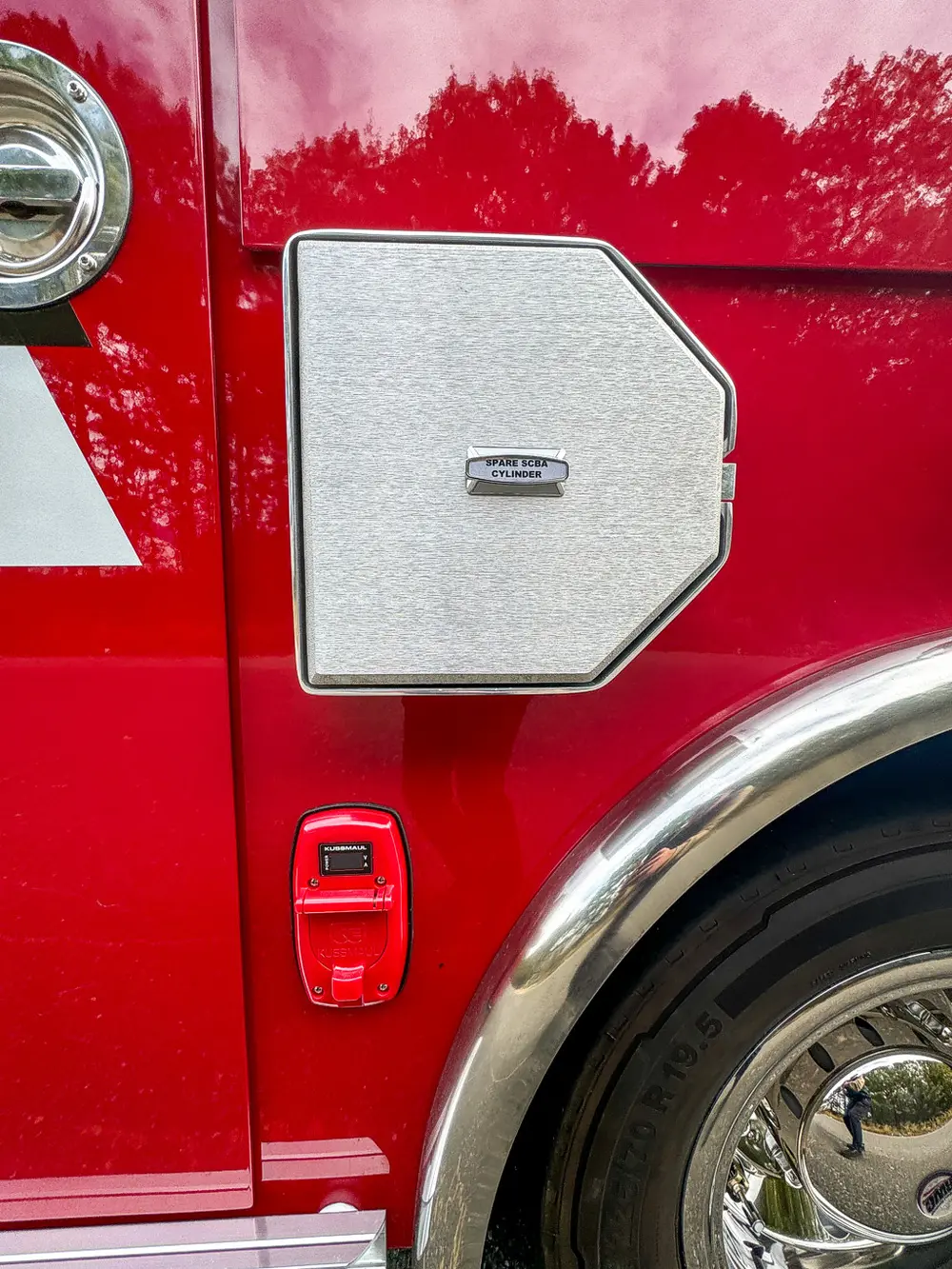 Lower side hatch close-up with hexagonal access door closed.