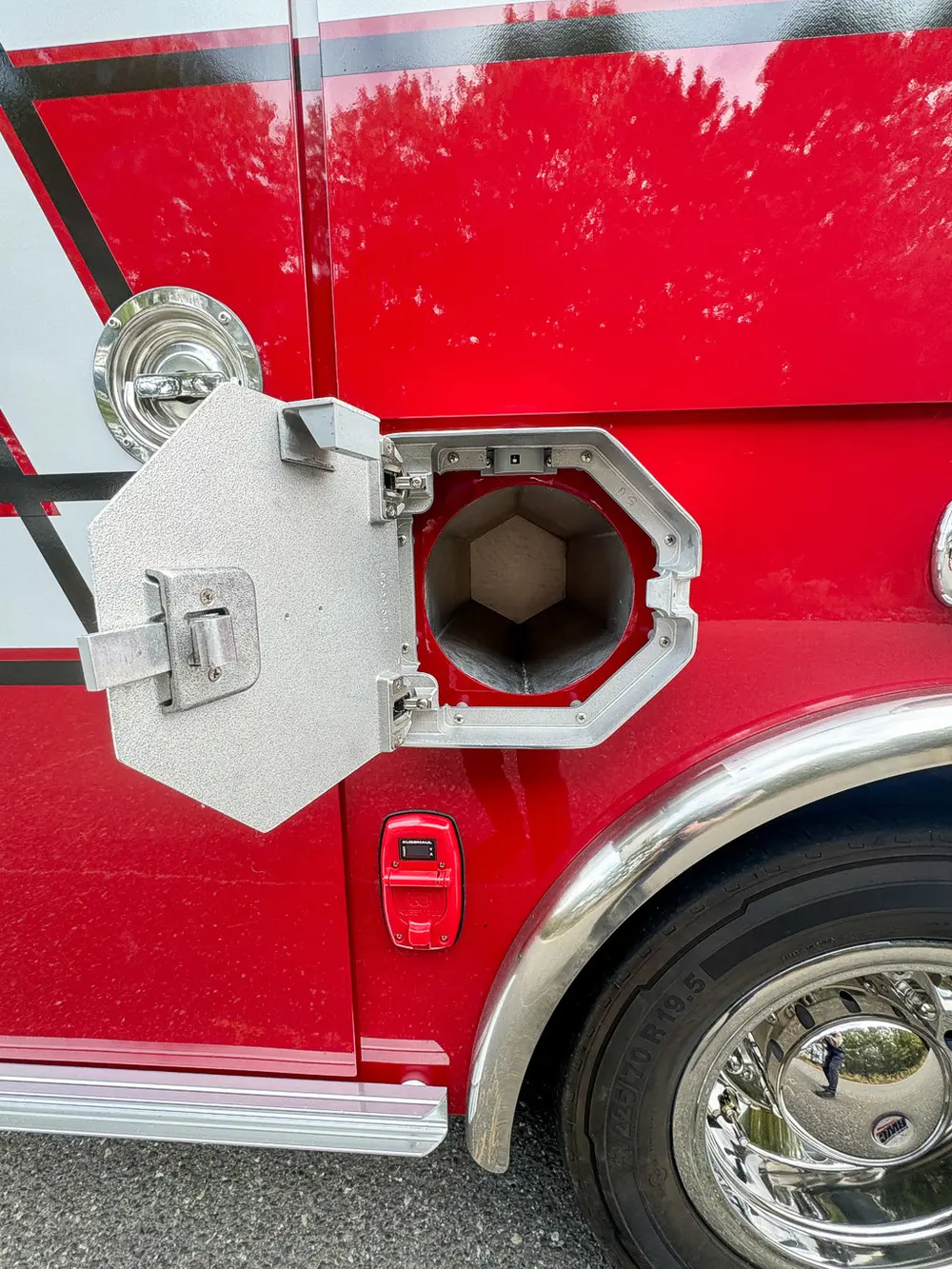 Lower side intake-port door open showing capped fitting.