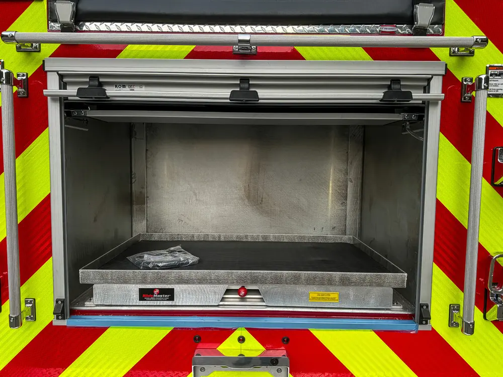 Rear center compartment open with fold-down shelf tray.