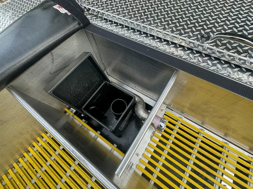Top deck hatch open revealing recessed utility bay.