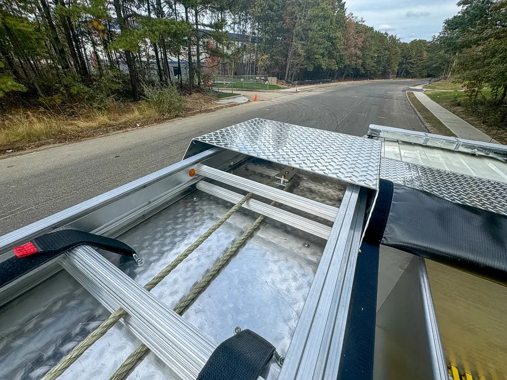Top deck near cab showing mounting rails and recessed center section.