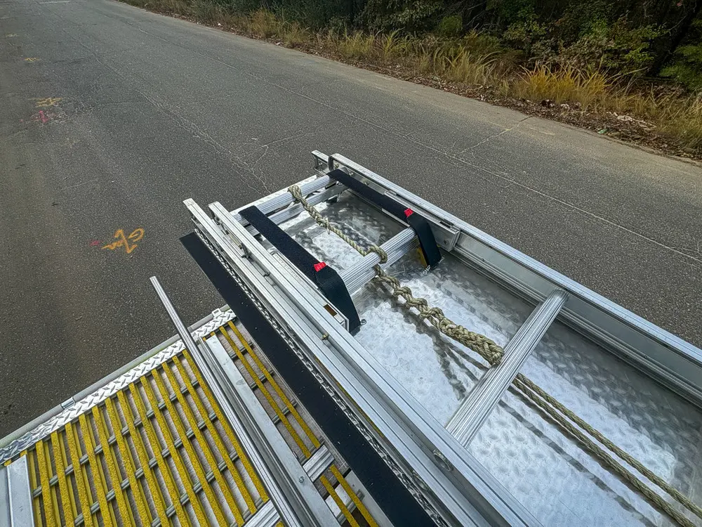 Top deck view with ladder, handrails, and open center deck panels.