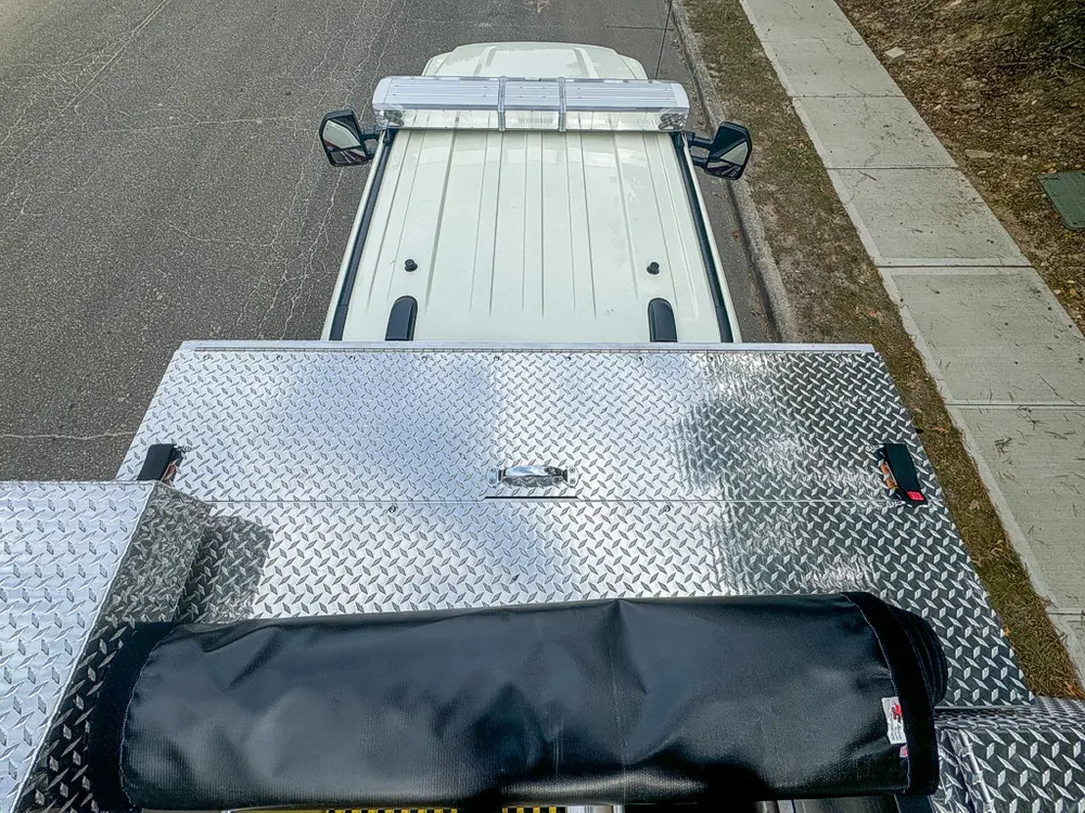 Top rear section with silver panel open over equipment area.