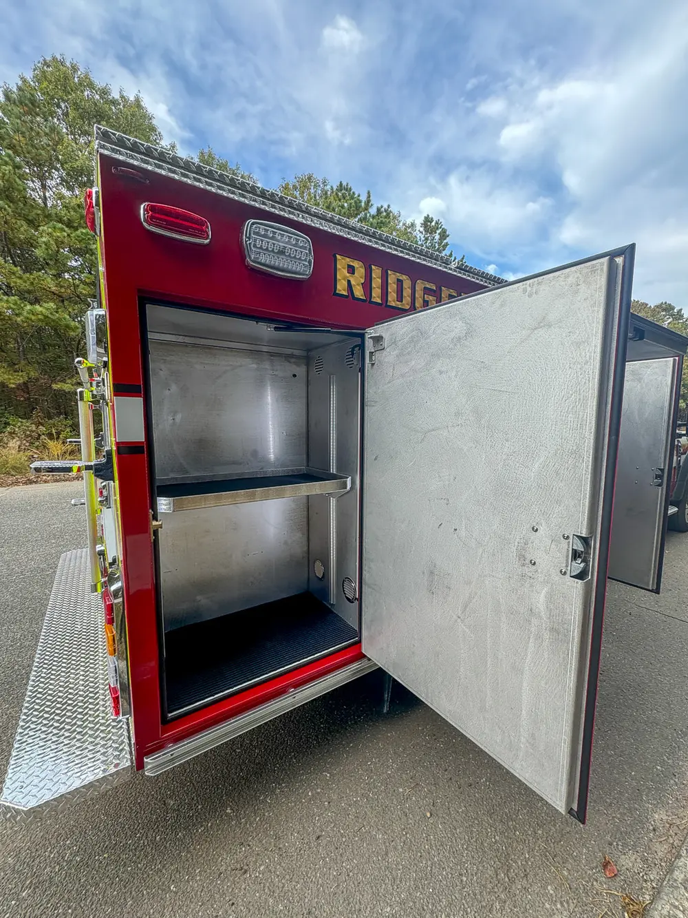 Open side compartment close-up with shelf and interior walls.