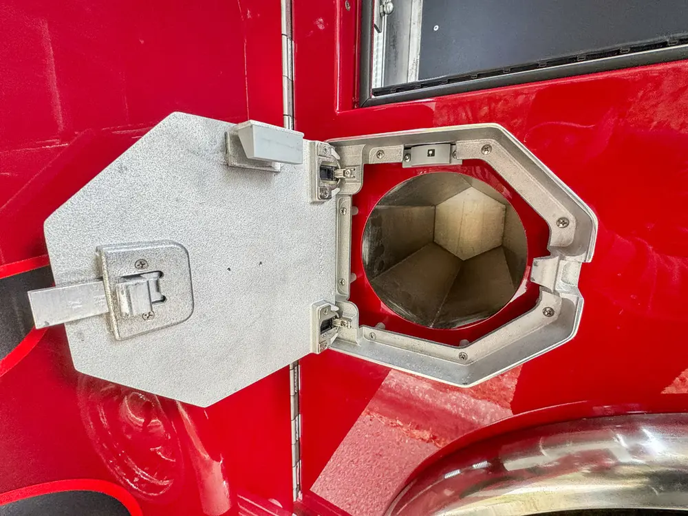 Lower intake-port hatch open showing octagonal fitting.