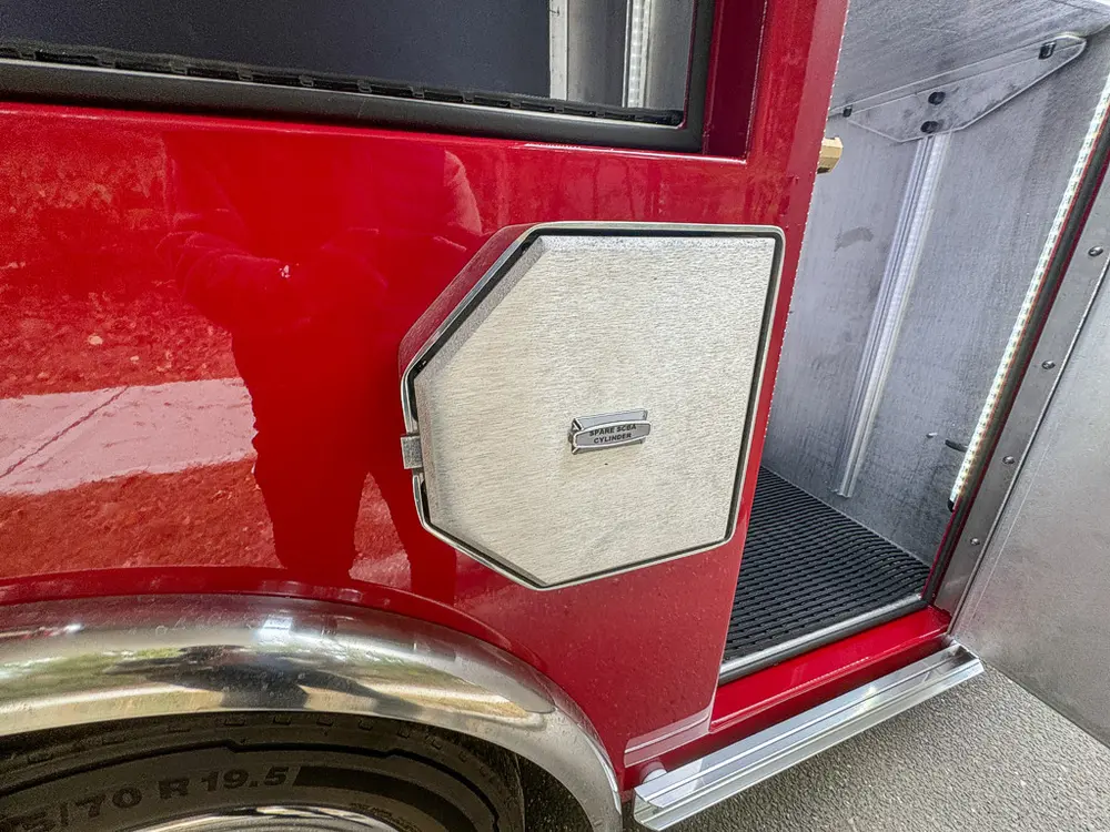 Small lower side hatch closed at intake-port location.