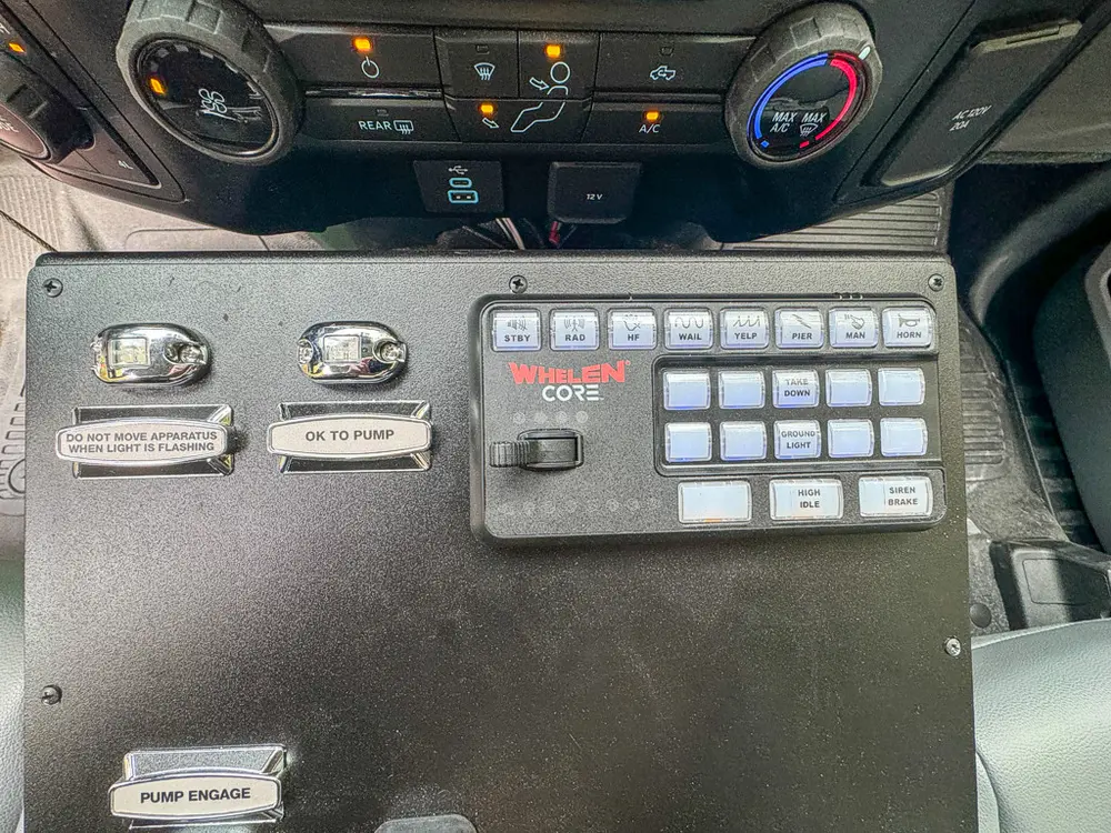 Whelen keypad and switch panel close-up on center console.