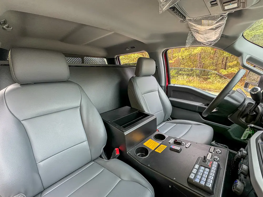 Front seats and center console view from passenger side.