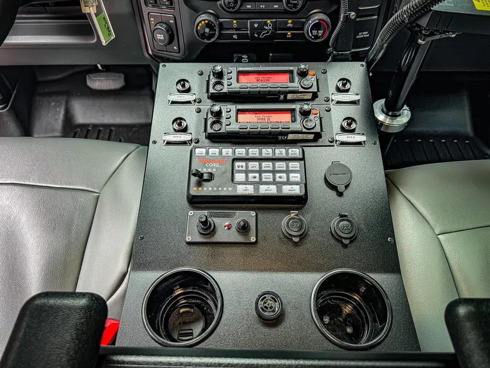 Lower console and radio stack close-up with keypad and cup holder.