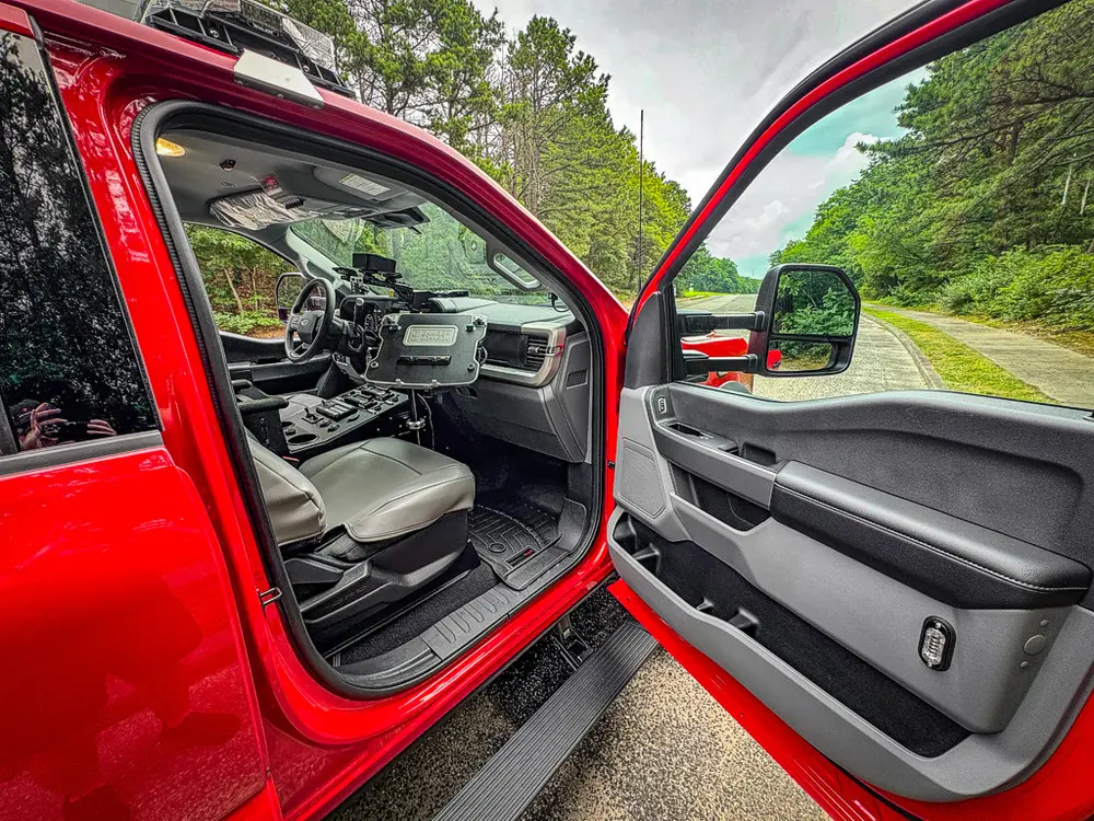 Open front passenger door view into the front cabin.