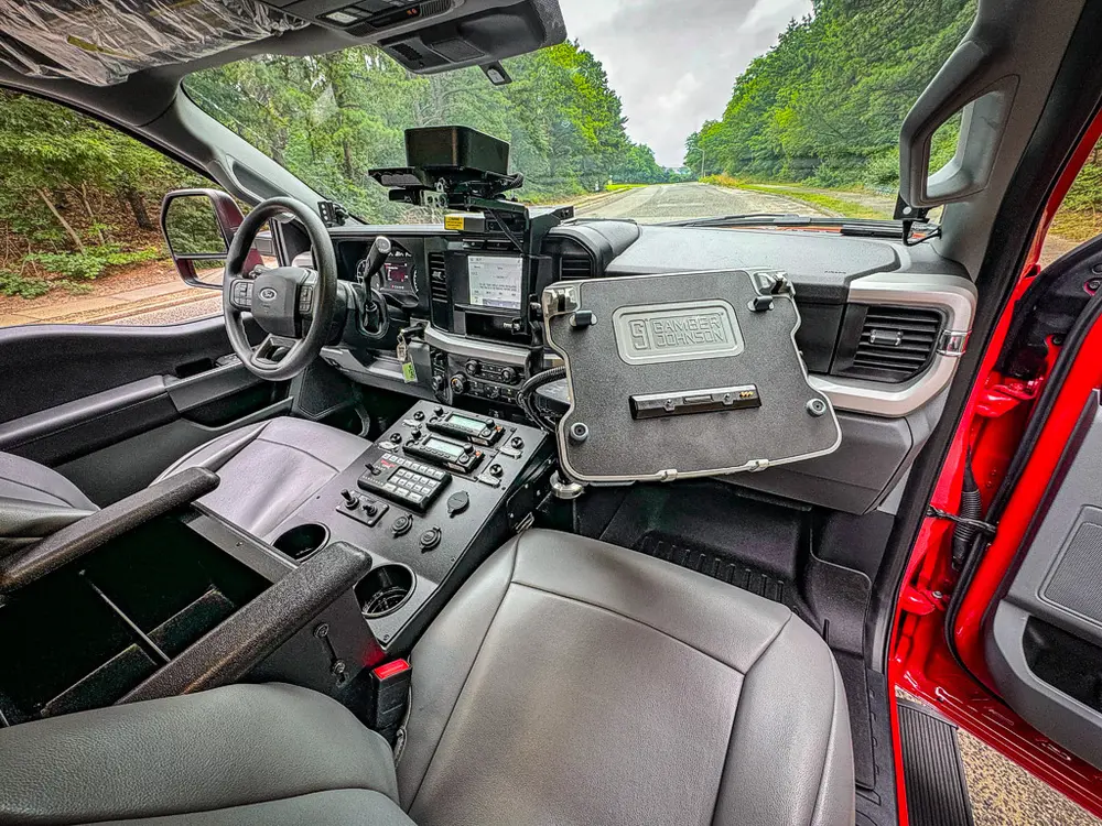 Wide front interior view with tablet mount and center controls.