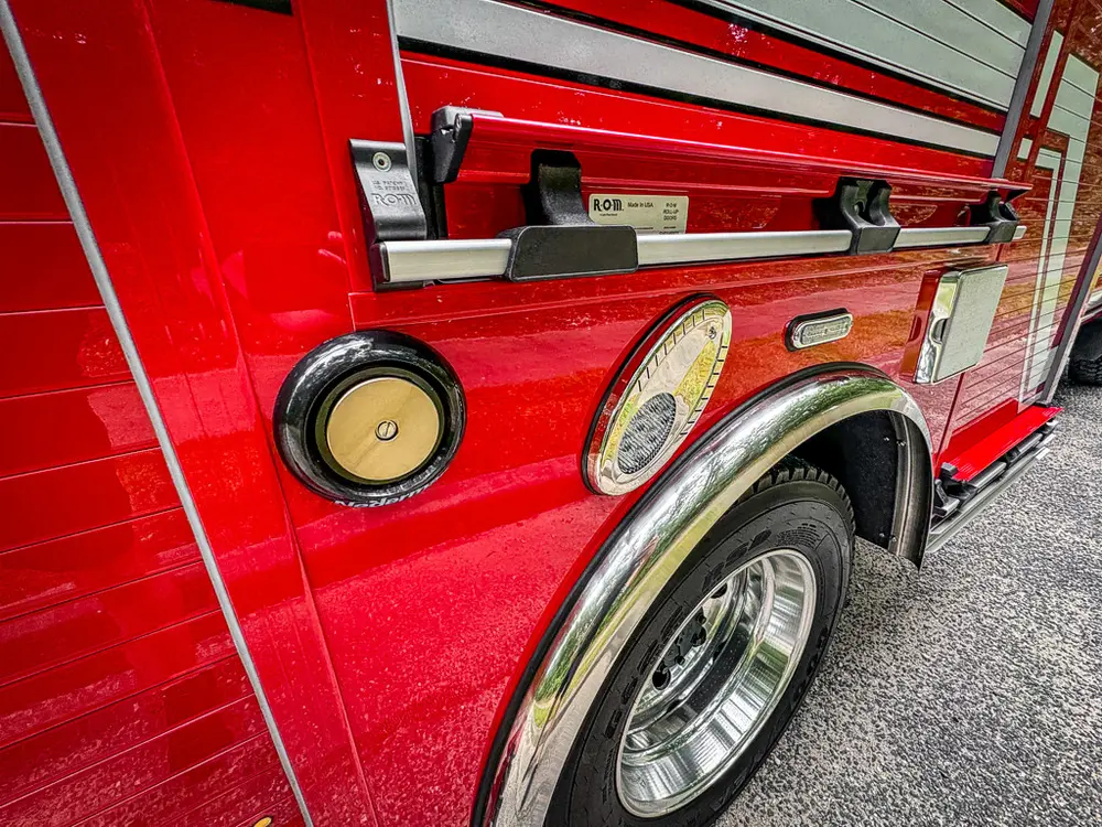 Side body close-up with marker light and mounted side components.