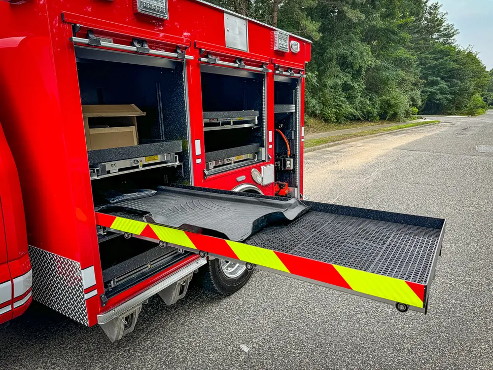 Rear-side compartment with lower slide-out tray extended outward.