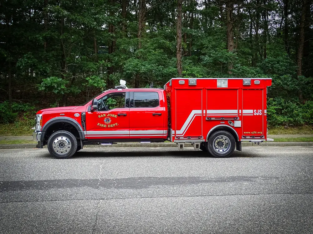 Full left-side profile of truck parked on roadway.