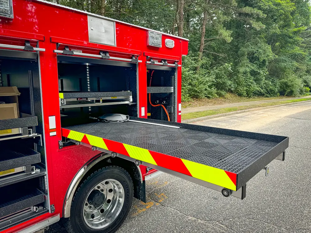 Open side compartments with shelves and lower platform extended outward.