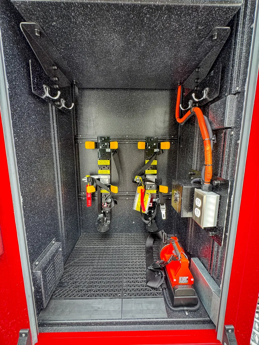 Vertical side rack with mounted electrical and rescue equipment.