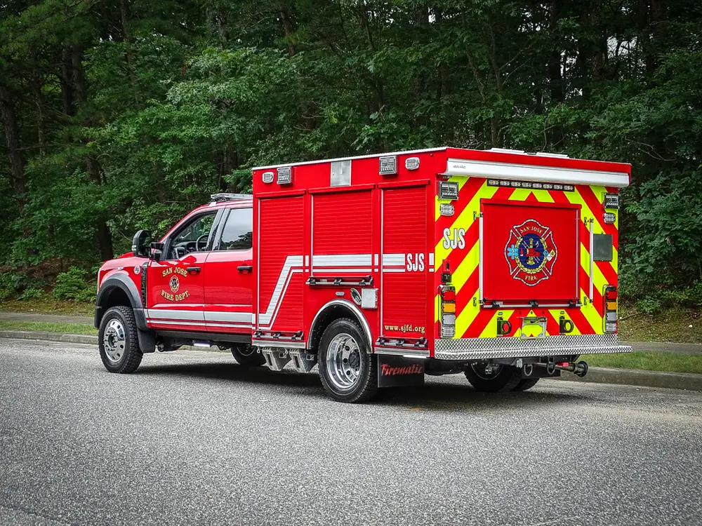 Rear-left three-quarter view with chevron rear panel visible.