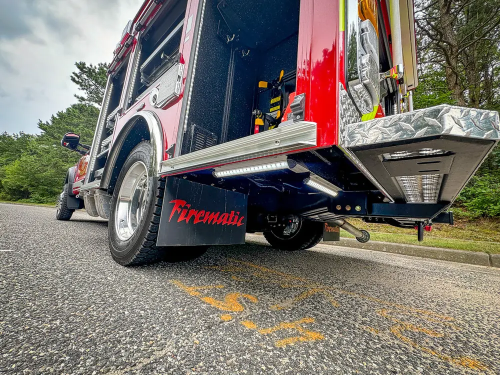 Rear-side angle showing fold-down step and underside components.