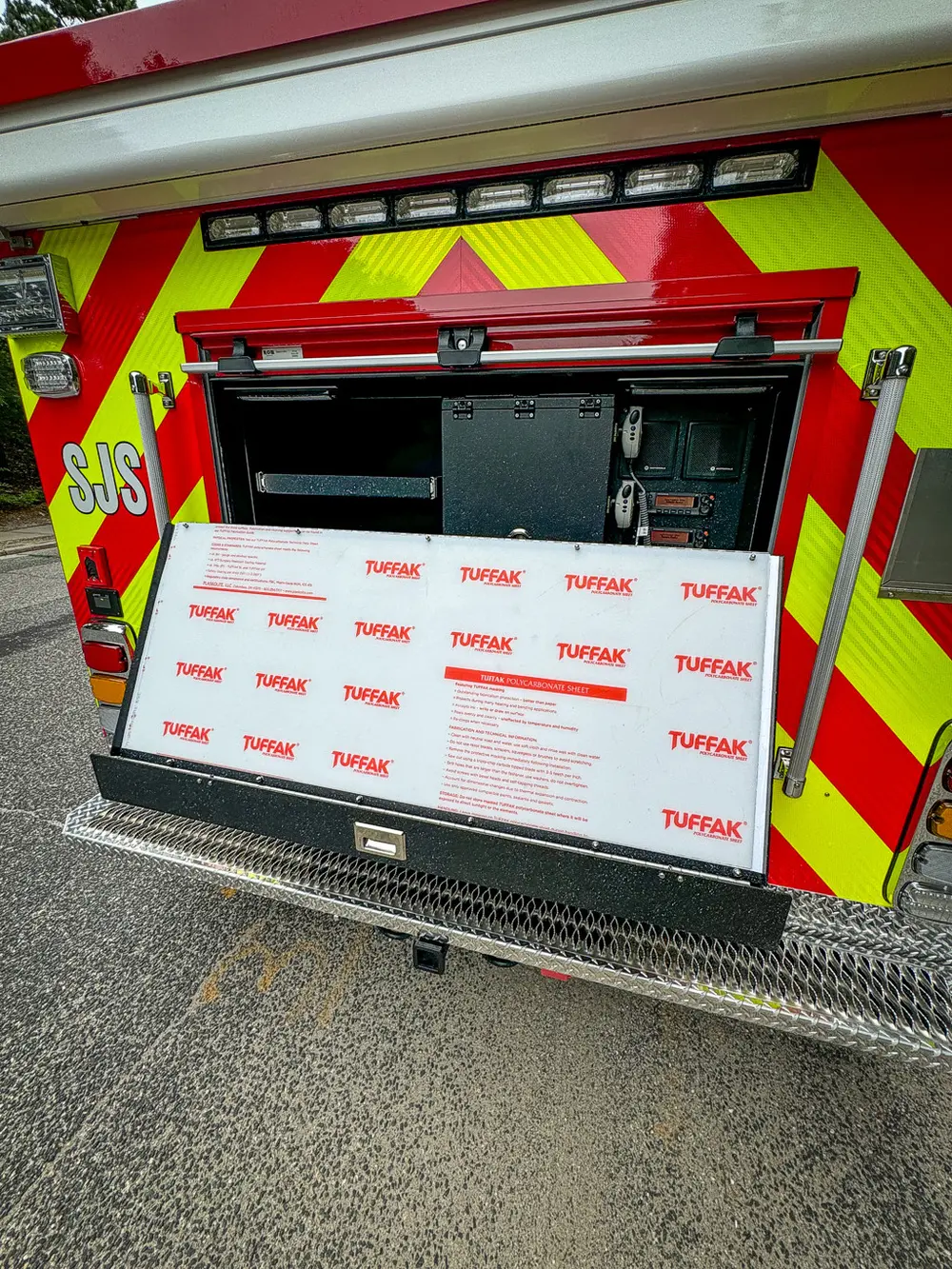 Rear lower panel open downward with white board on fold-down section.