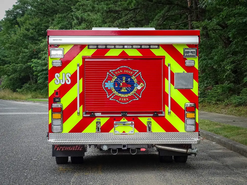 Straight rear view with chevron striping and department emblem.