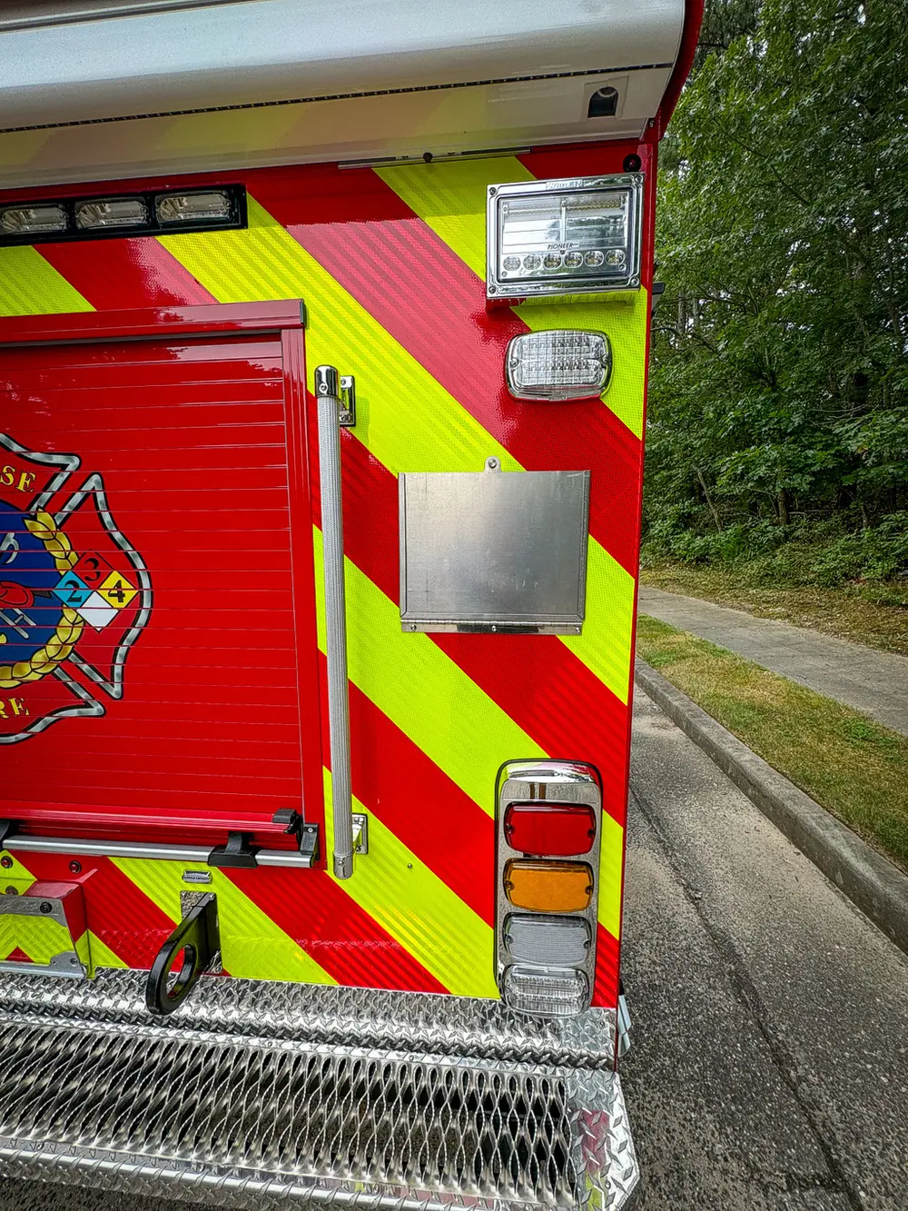 Rear corner view with closed roll-up door and side marker lights.