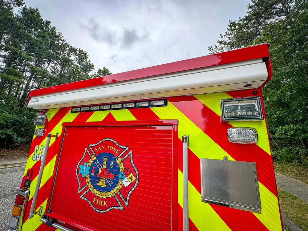 Rear view with upper hatch raised above closed center panel.