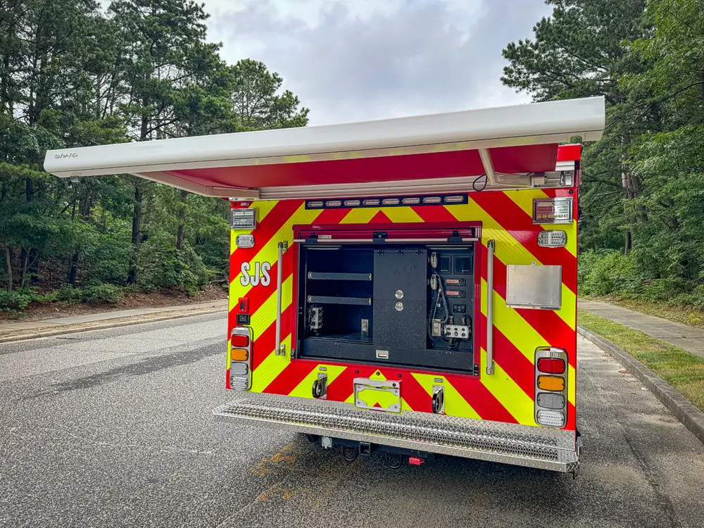 Rear center compartment open with upper hatch lifted and shelves visible.