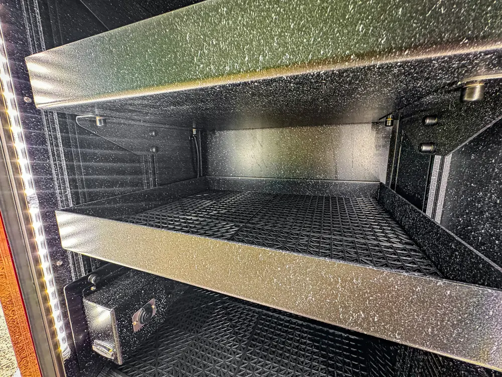 Open side compartment with two horizontal shelves and empty interior.