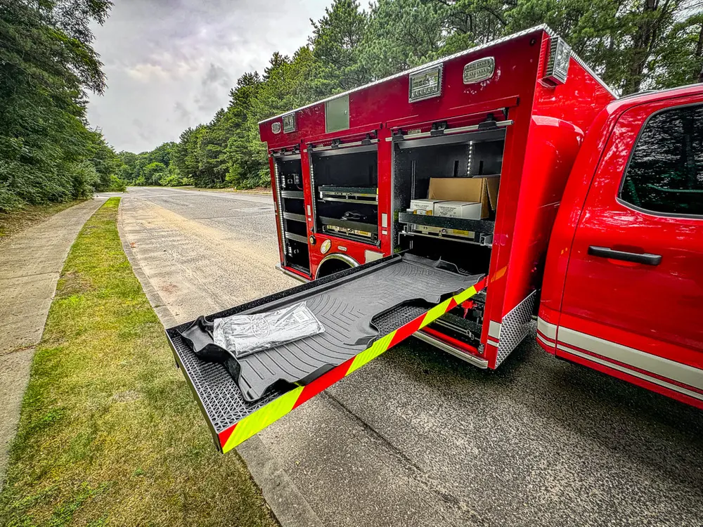 Right-side view with lower tray extended and mid compartments open.