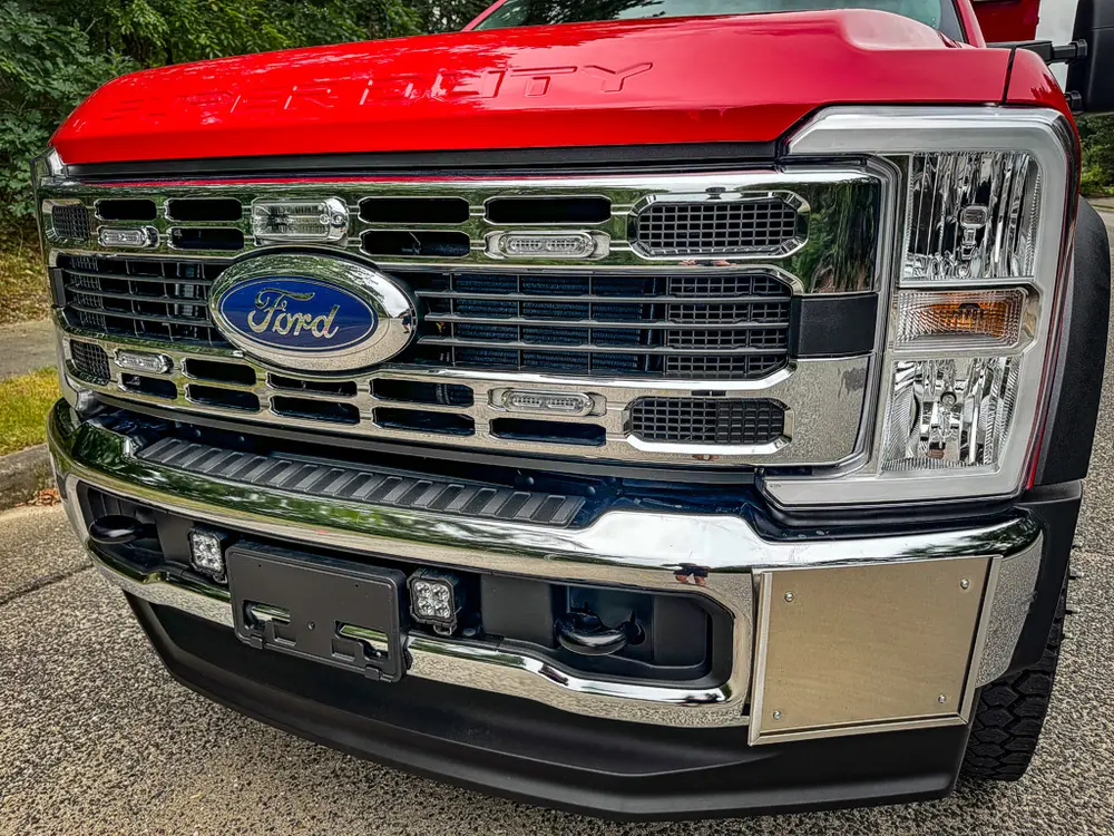 Front grille close-up with Ford emblem and bumper details.