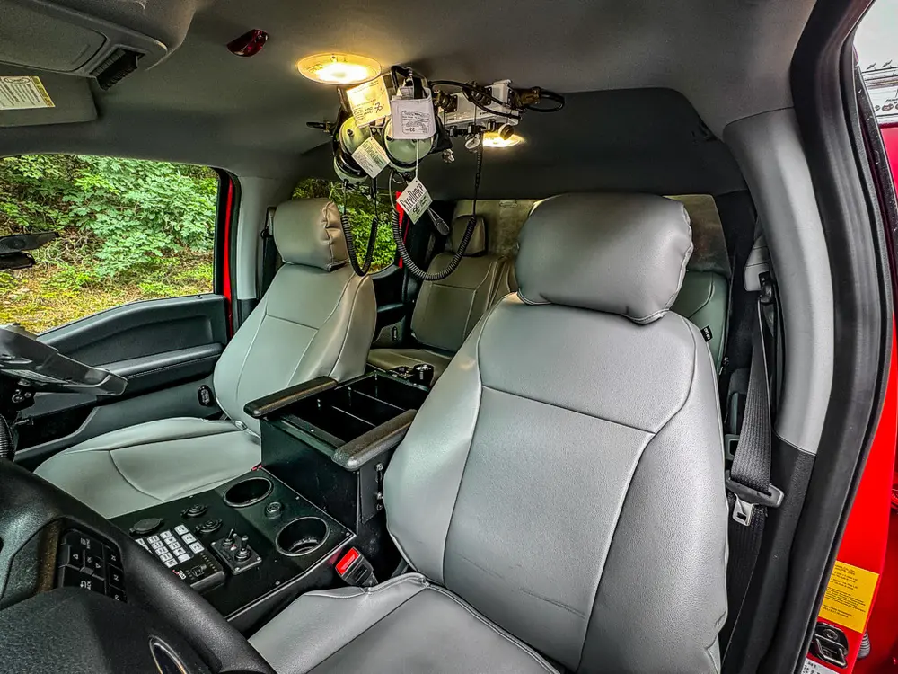 Passenger-side interior view with front seats and console.