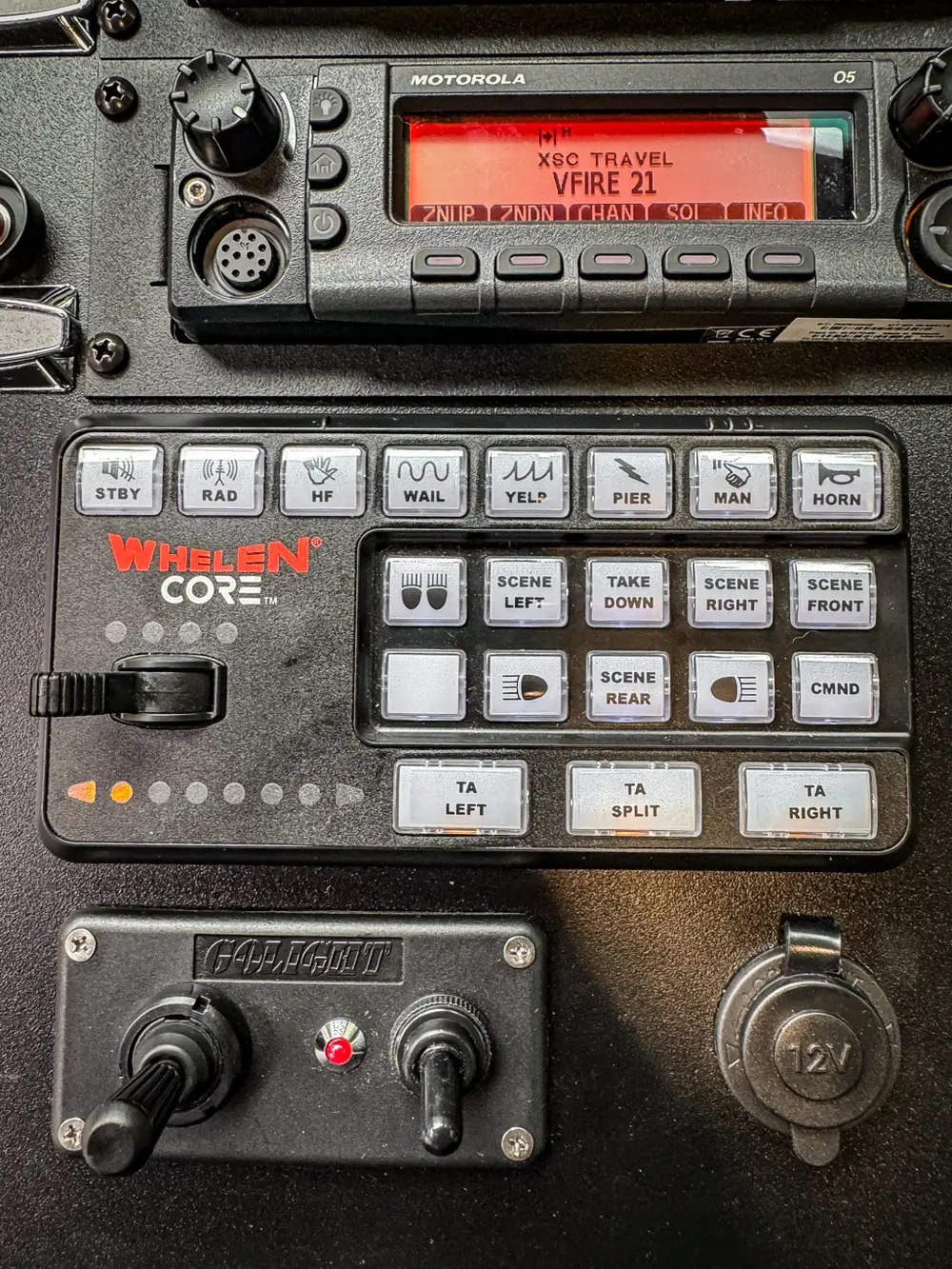 Whelen control keypad close-up with labeled emergency buttons.