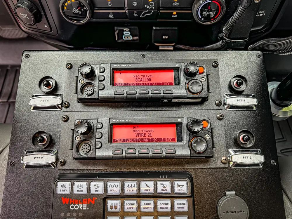 Dual radio units and control panel close-up on center console.