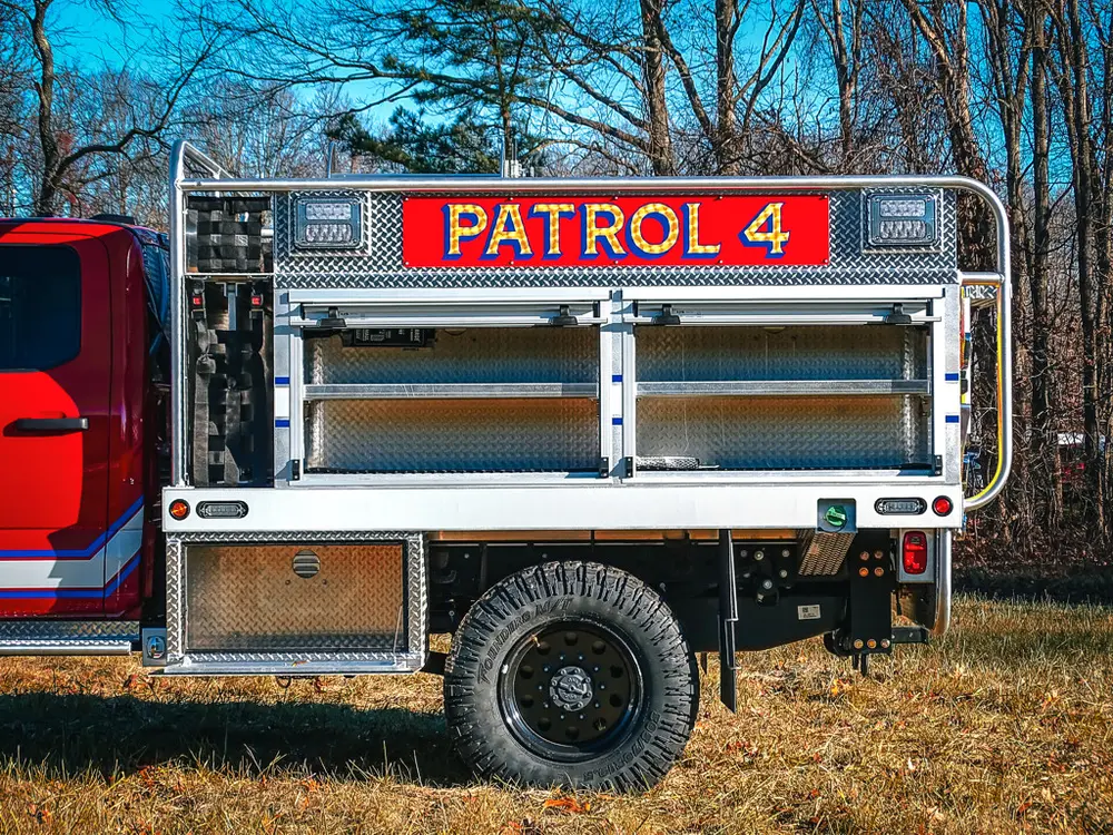 Right-side compartments open showing shelves and storage bays.