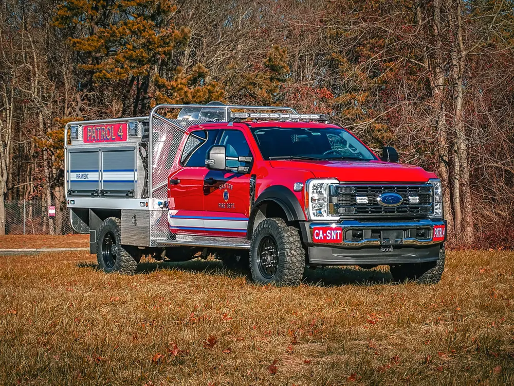 Front-left side view showing cab and rear utility body.
