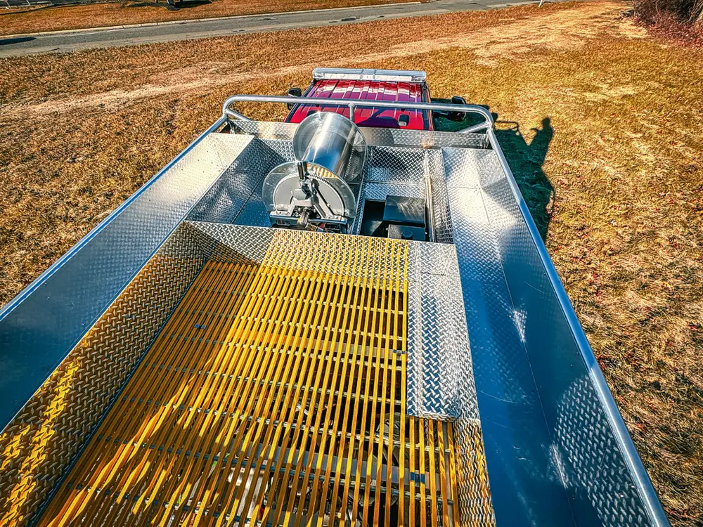 Top deck view showing yellow grated walkway and center equipment bay.