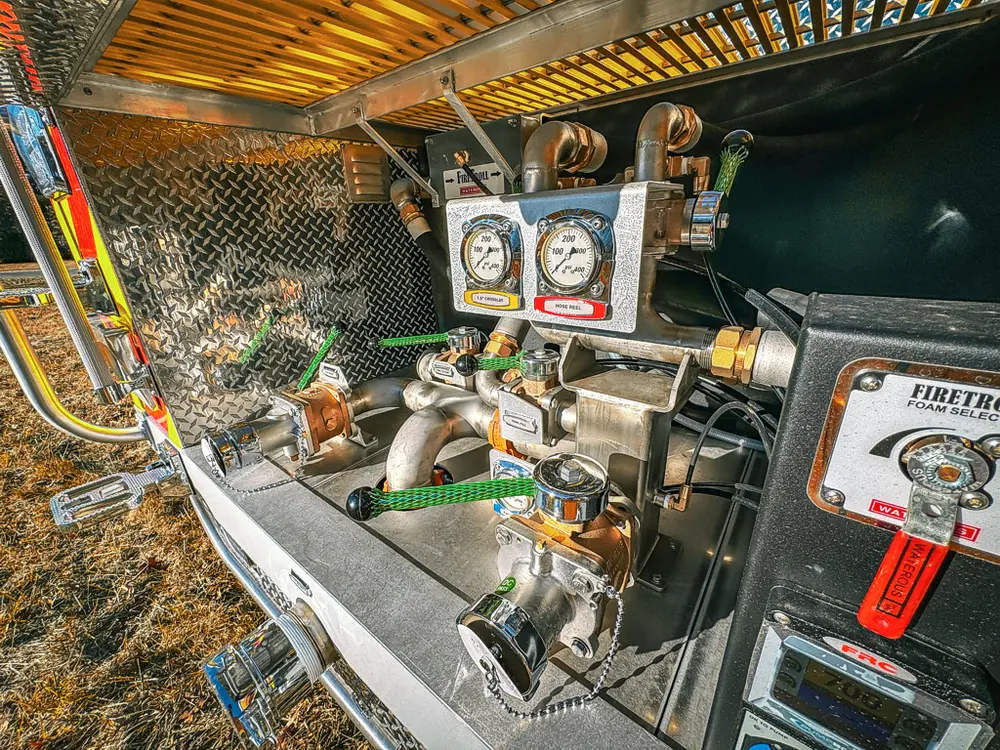 Rear pump compartment close-up from side showing control cluster.