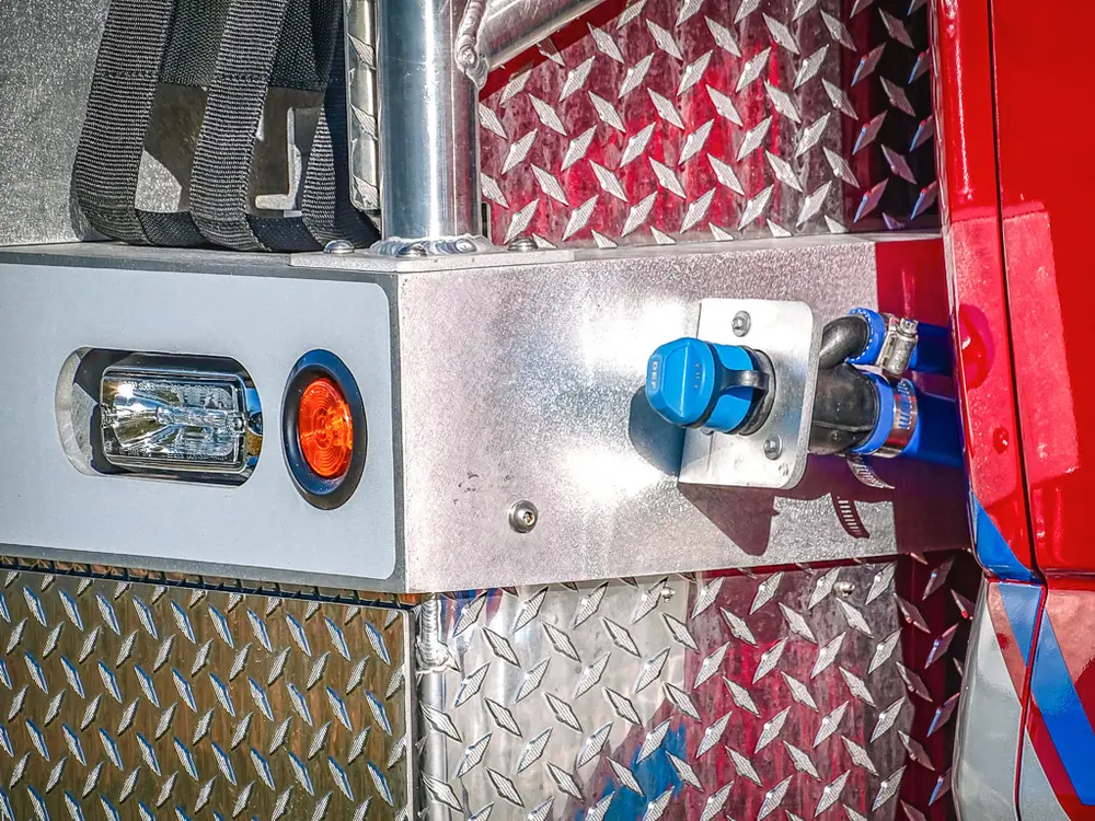 Front side panel close-up with blue intake/outlet fitting.