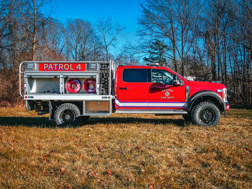 Right-side view with compartments and hose storage visible.