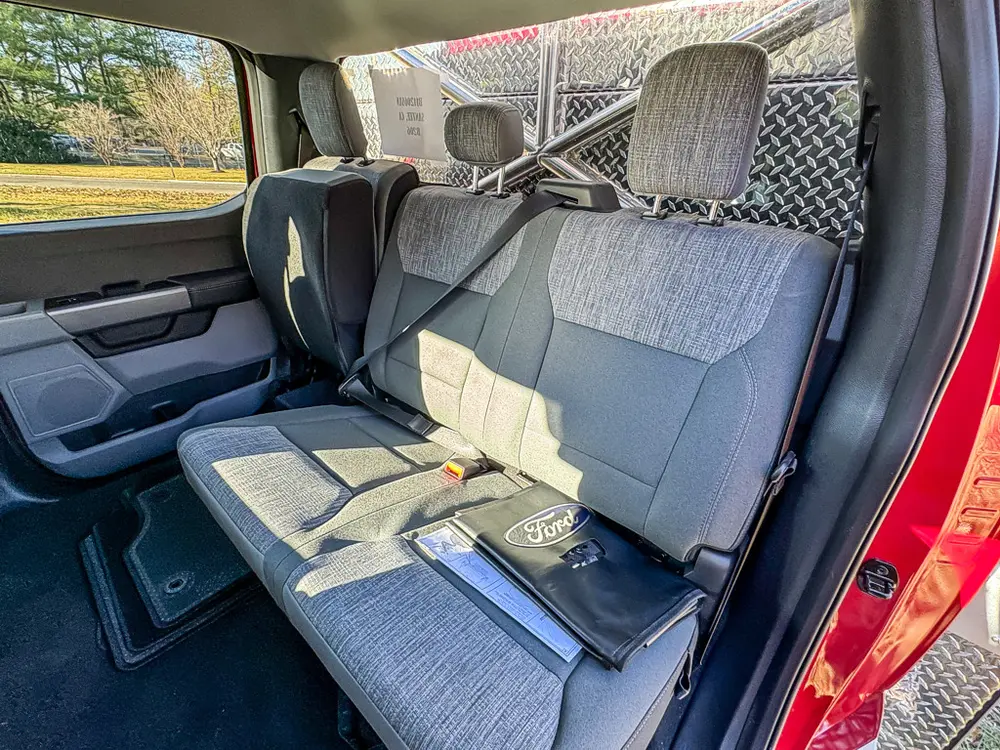 Rear bench seating view with fold-down center armrest.