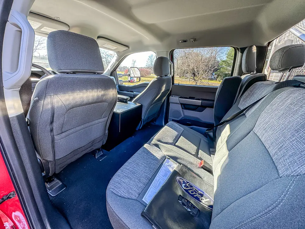 Rear cabin view from opposite side with bench and floor space.